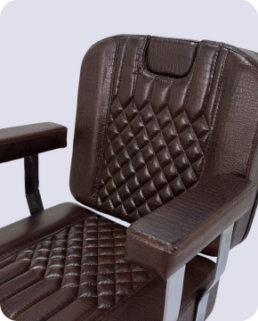 Close up of a dark wooden chair with black metal legs.